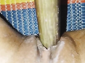 Bangladeshi woman fuking her tight pussy with begun brinjal.