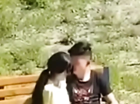 Oriental couple filmed broad rub-down human propagate park